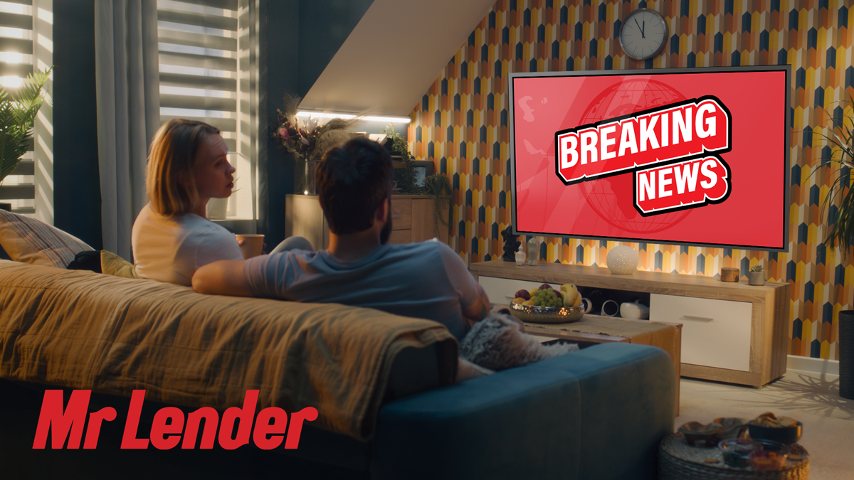 Couple watching TV when there is some breaking news