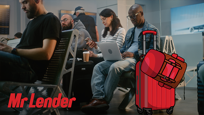 A group of people sat in an airport waiting for their flight